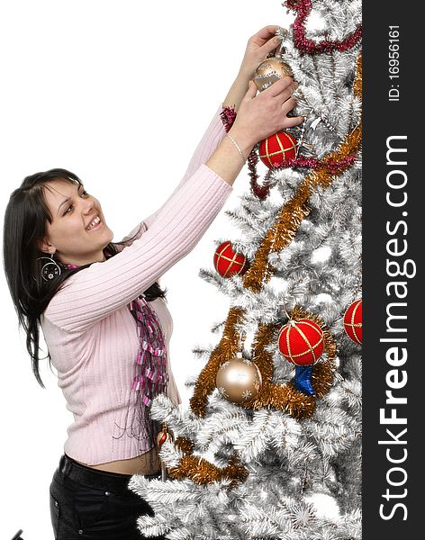 Girl decorating the christmas tree.. Isolated.
