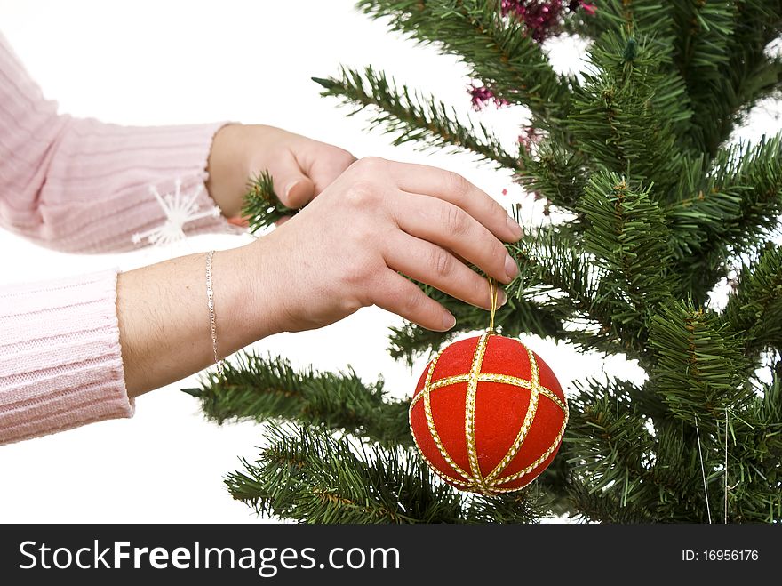 Christmas tree, ball and hand of christmas girl. Isolated.