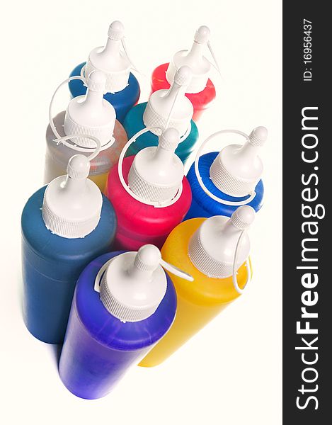 Group of color tubes over white background