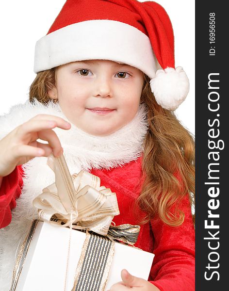 Girl in christmas hat opening a gift