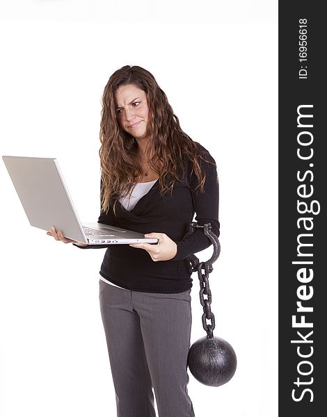 A woman is chained to her computer. A woman is chained to her computer.