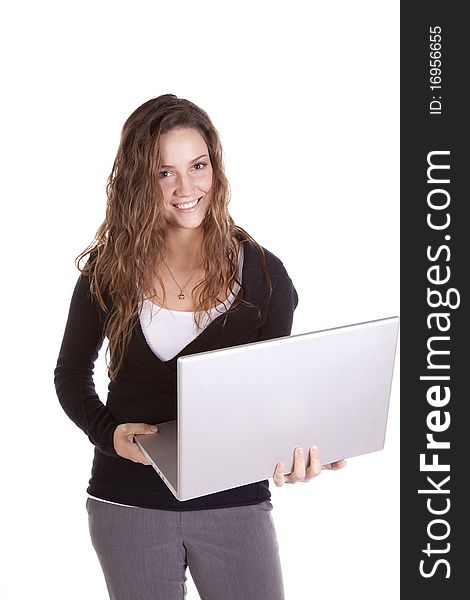 A business woman is holding a laptop computer. A business woman is holding a laptop computer.