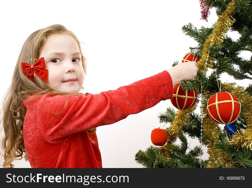 Little Girl decorating the christmas tree.. Isolated.
