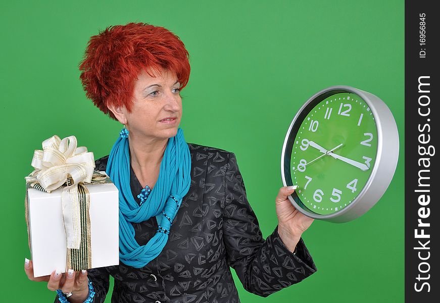 Woman with gift box and clock