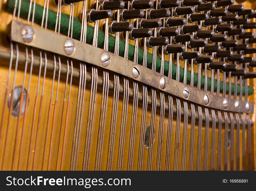 The insides of a vintage piano. The insides of a vintage piano