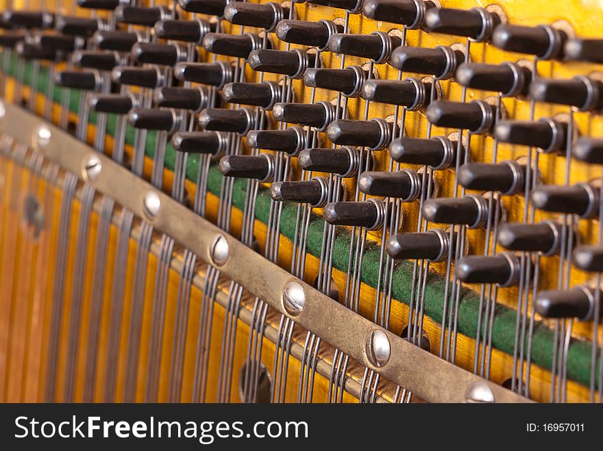 The insides of a vintage piano. The insides of a vintage piano