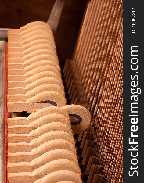 The insides of a vintage piano. The insides of a vintage piano