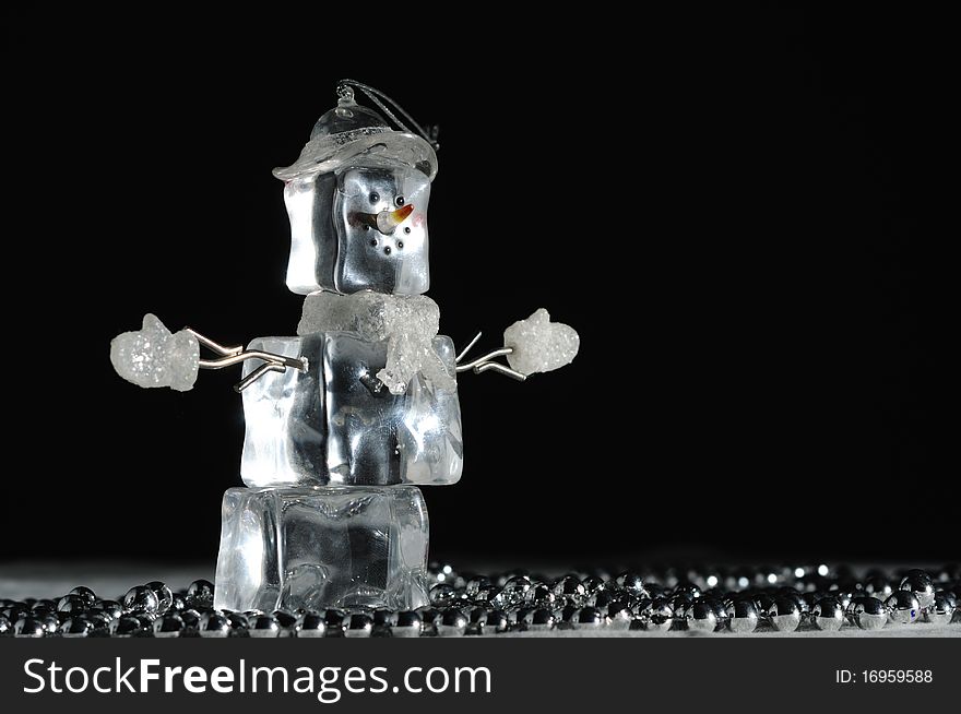 Christmas Snowman ornament made of ice over black background. Christmas Snowman ornament made of ice over black background
