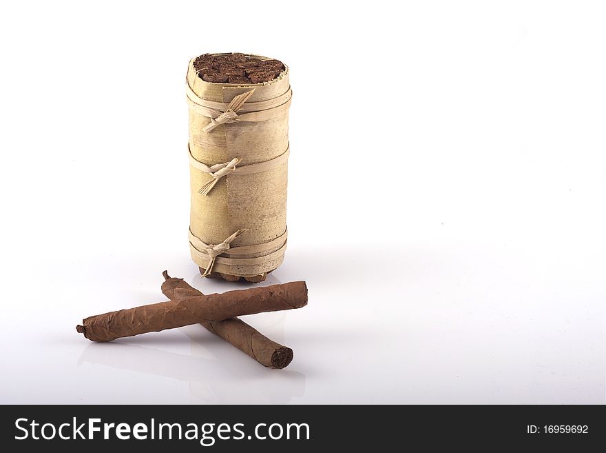 Two hand rolled cigars and a cuban humidor isolated on a white background