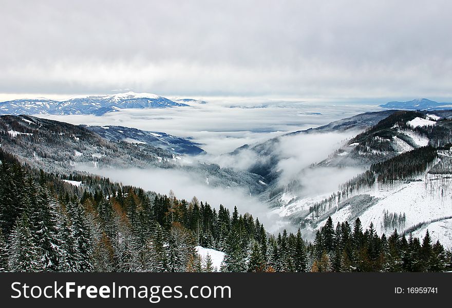 Beautiful snow-covered mountain with clouds. Beautiful snow-covered mountain with clouds