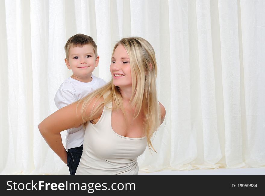 Young mother and son having fun together