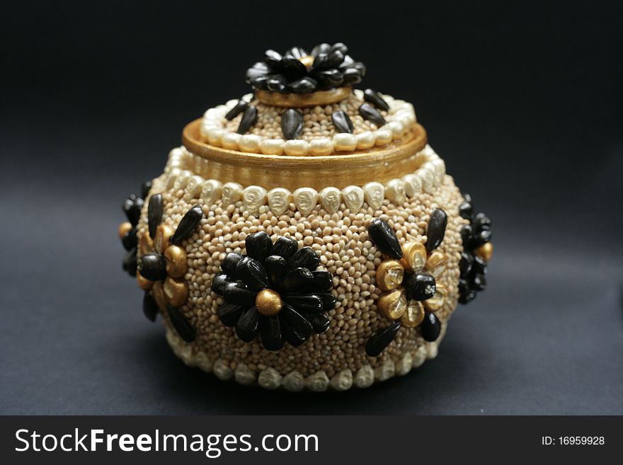 Pot decorated with seeds of plants. Pot decorated with seeds of plants