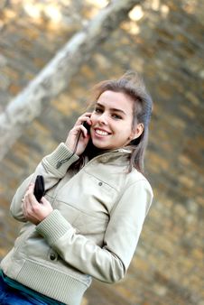 Girl Talking On A Cell Phone Stock Images