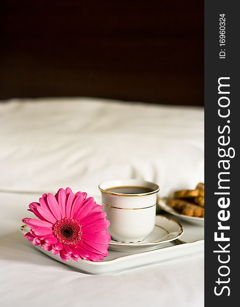 White tray with breakfast and pink flower. White tray with breakfast and pink flower