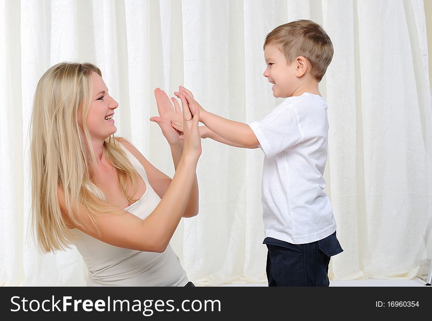 Young mother and son having fun together