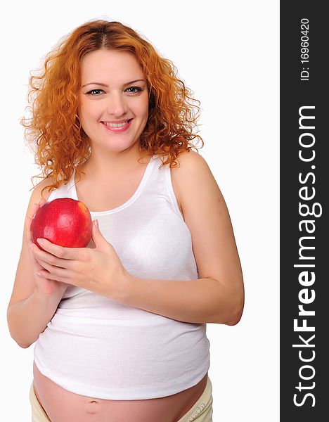 Young redhead pregnant mom thinks about healthy food