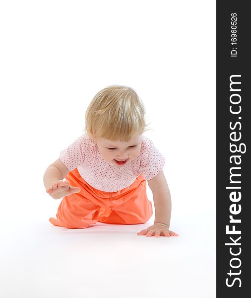 Studio portrait of baby running on all fours