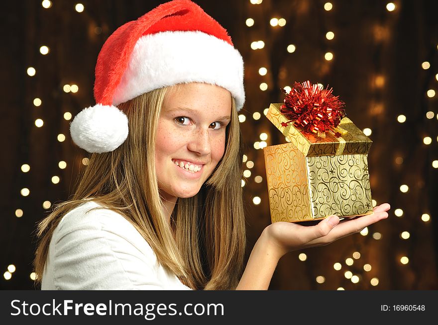 Girl Smiles With Open Gift