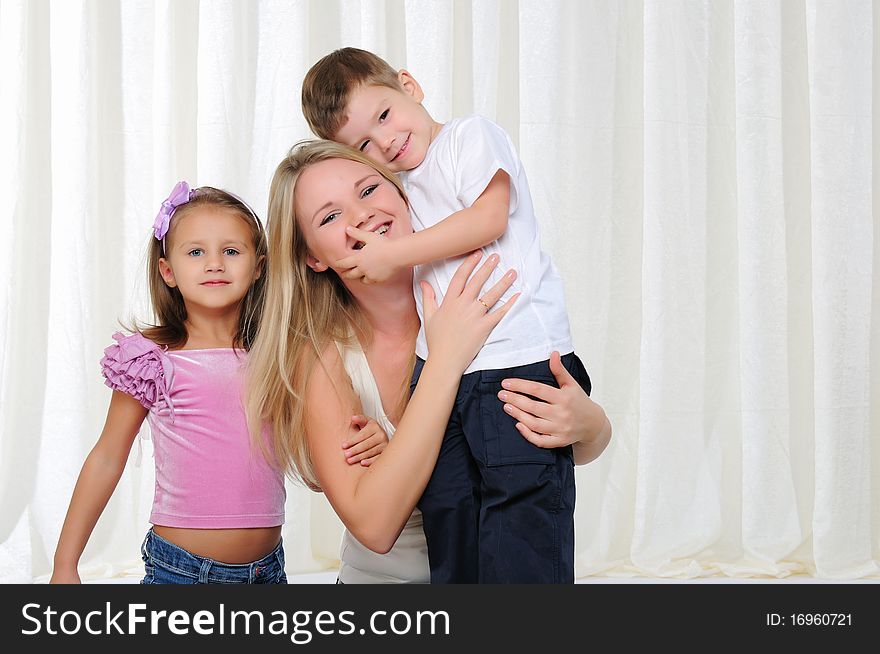 Young Mother, Her Daughter And Son