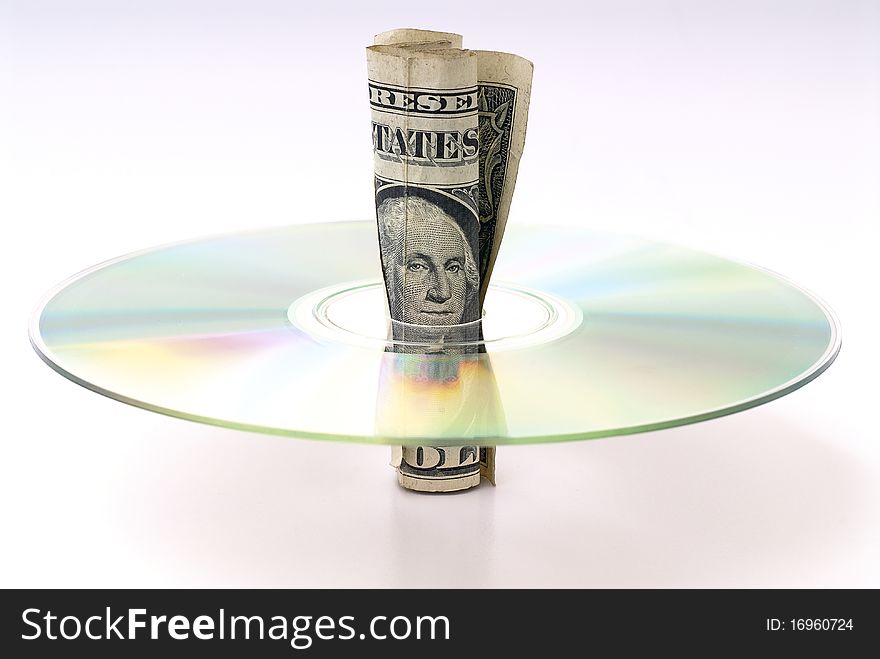 U.S. dollars rolled in the middle of a CD. U.S. dollars rolled in the middle of a CD