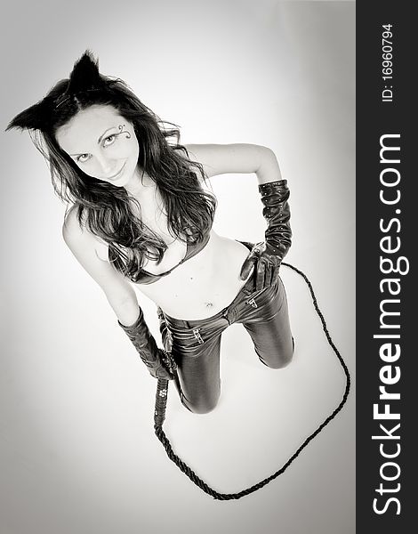catwoman in black leather pants with whip. Black and white. catwoman in black leather pants with whip. Black and white