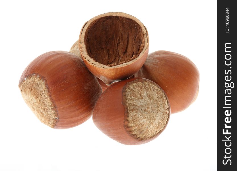 Handful of hazelnuts isolated on white