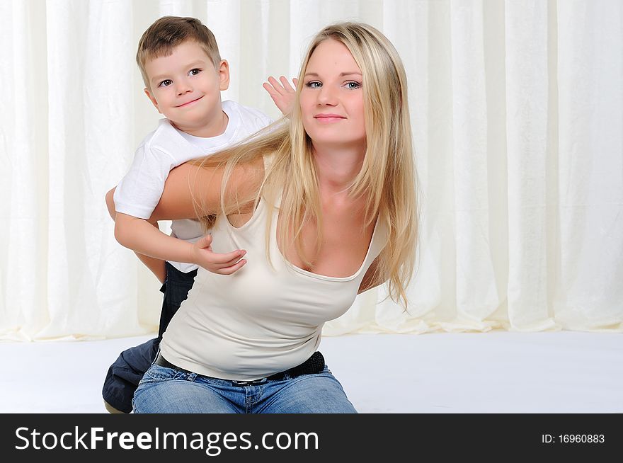 Young mother and son having fun together