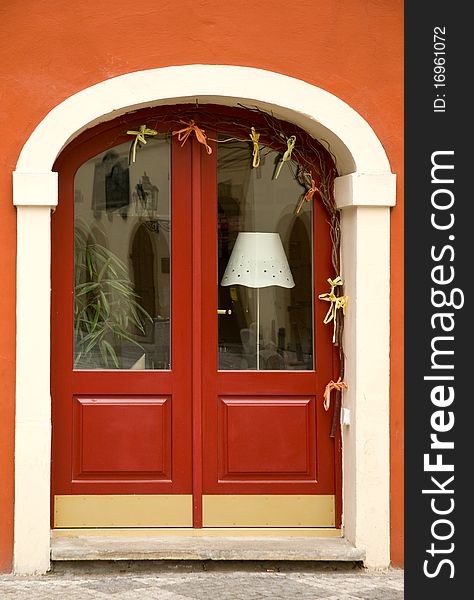 Red wooden door with windows