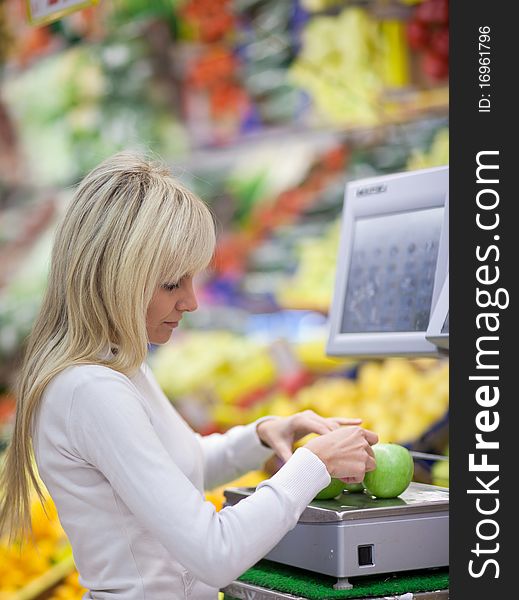 Woman shopping for fruits and vegetables