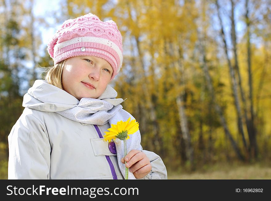 Little Girl With A Yellow Flower