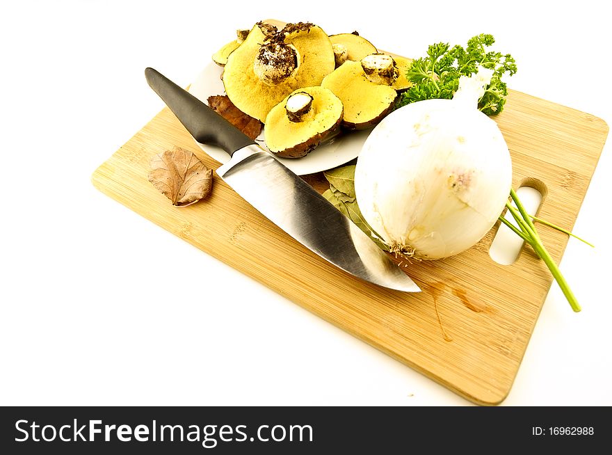 Plate of mushrooms on a kitchen board