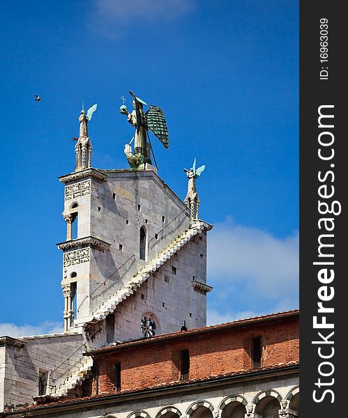 Church facade against a slightly cloudy sky. Church facade against a slightly cloudy sky.