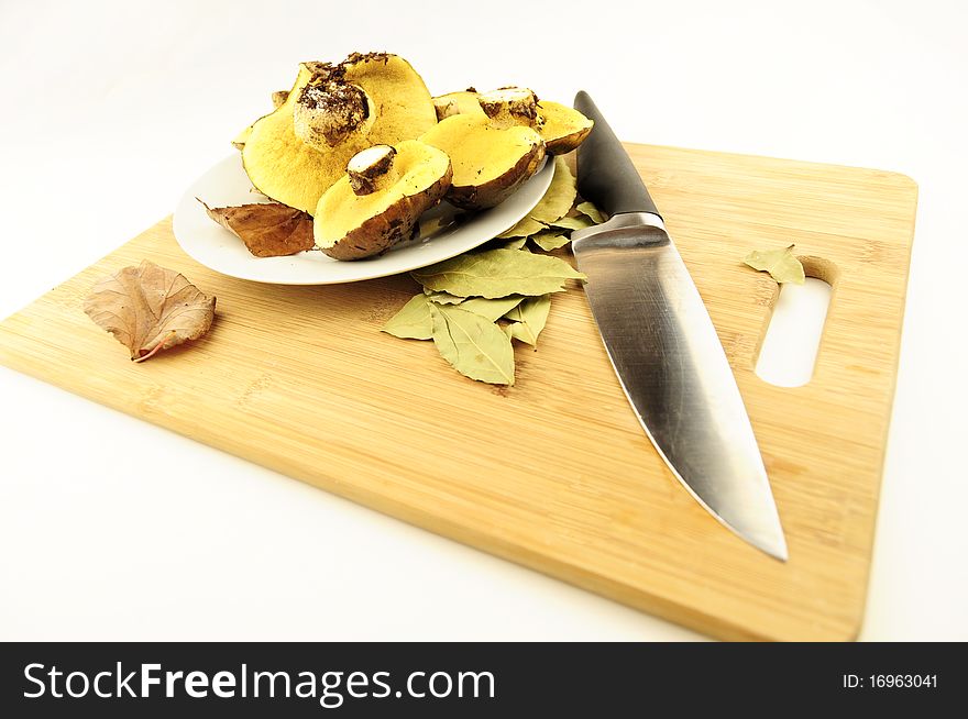 Plate of mushrooms on a kitchen board