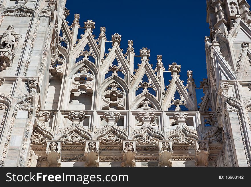 Close up of gothic detail on cathedral facade in Milan.