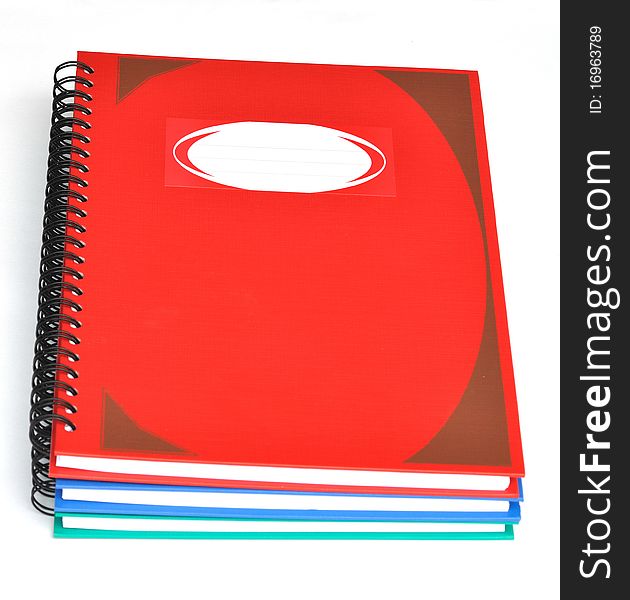 Stack of three color rectangular notebooks. Stack of three color rectangular notebooks.