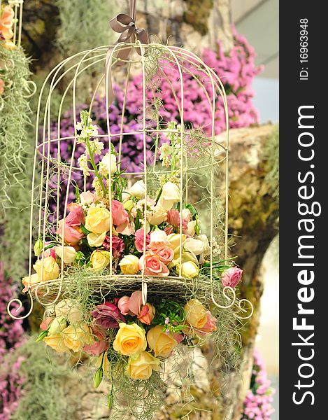 Decoration of colorful flower in cage.