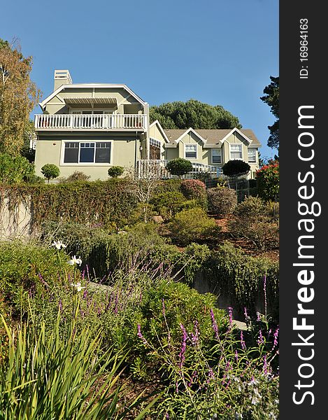 House at top of hill with landscaping