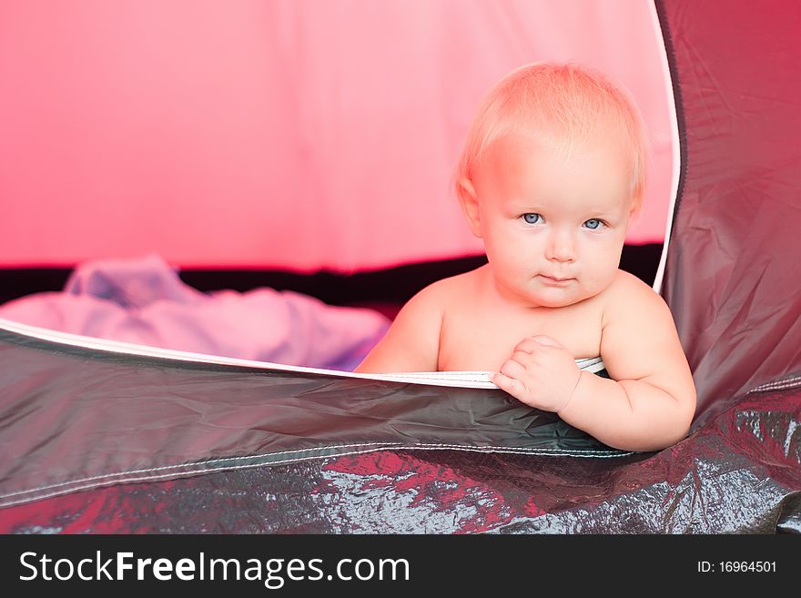 Baby sit near tent entrance