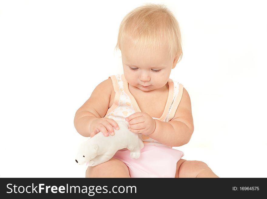 Cute Baby Girl Sitting And Playing With Bear