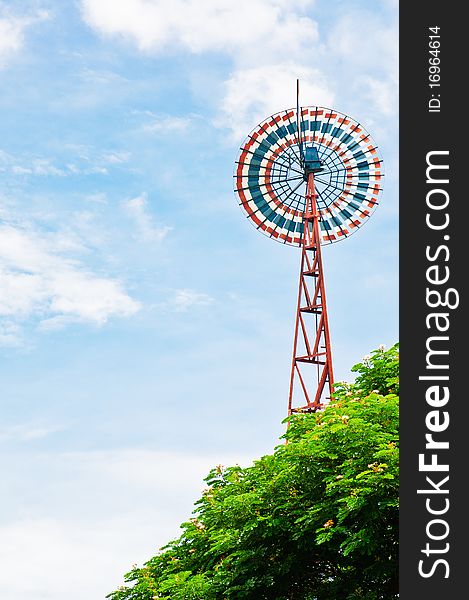 A windmill on clear sky.