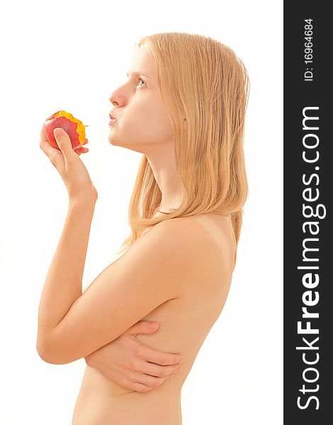 Beautiful young girl eating a peach on white.