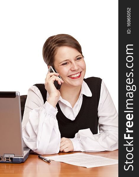 Young happy business woman calling at desk in office. Isolated on white background. Young happy business woman calling at desk in office. Isolated on white background.