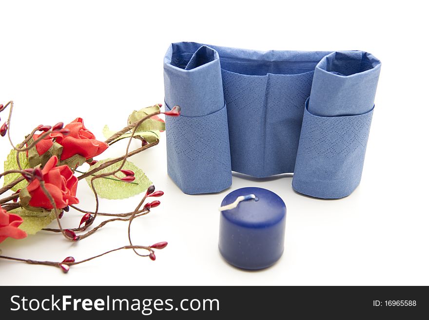 Napkin folded with candle and flowers