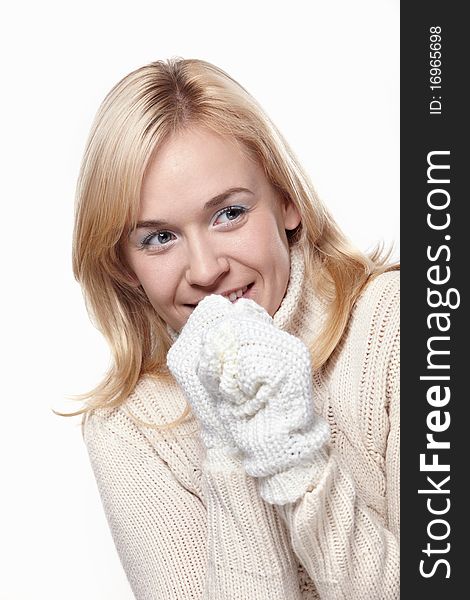 Attractive girl in a sweater and mittens. Attractive girl in a sweater and mittens