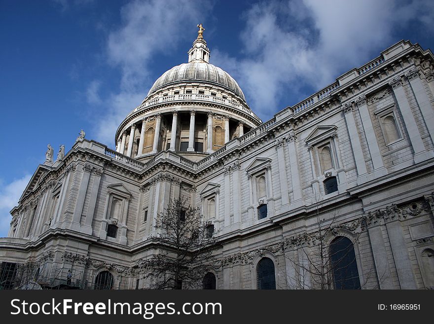 Christopher Wren's Saint Pauls Cathedral, London against a blue sky