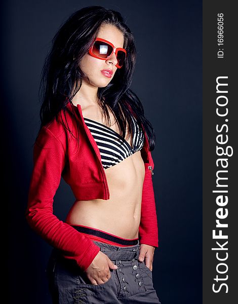 woman portrait on dark background with sunglasses. woman portrait on dark background with sunglasses