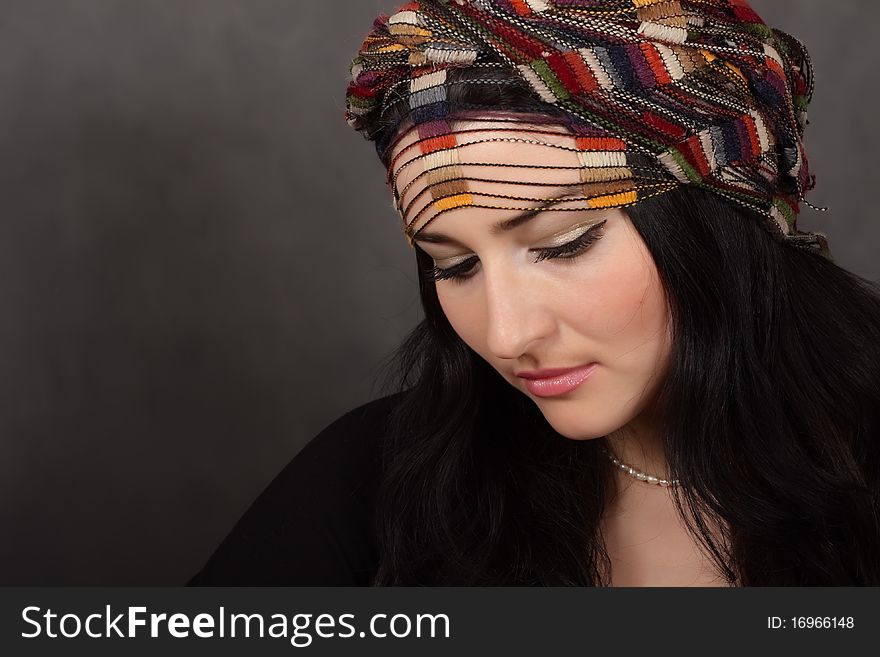 Portrait of beautiful girl in a shawl