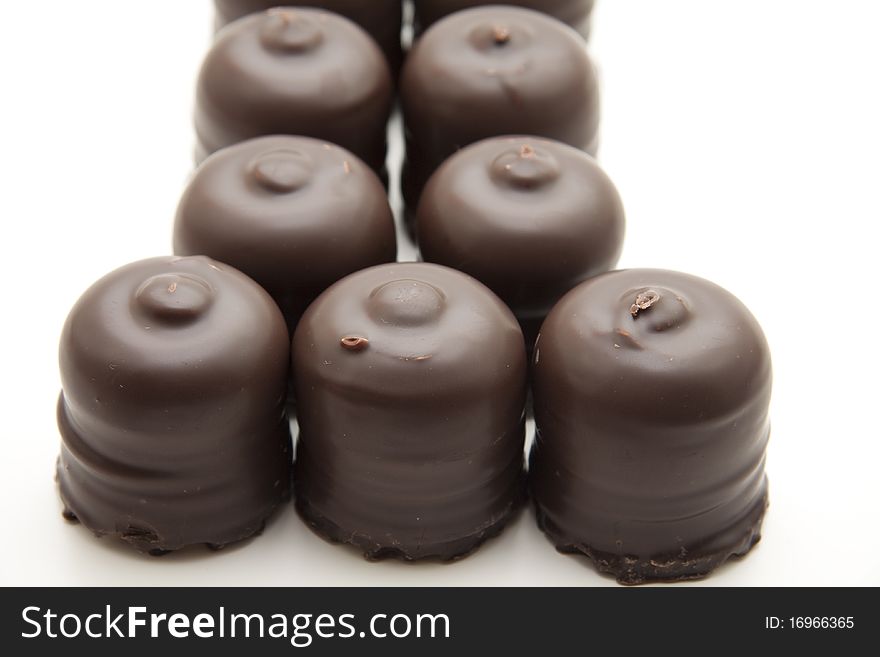 Marshmallow with chocolate onto white background