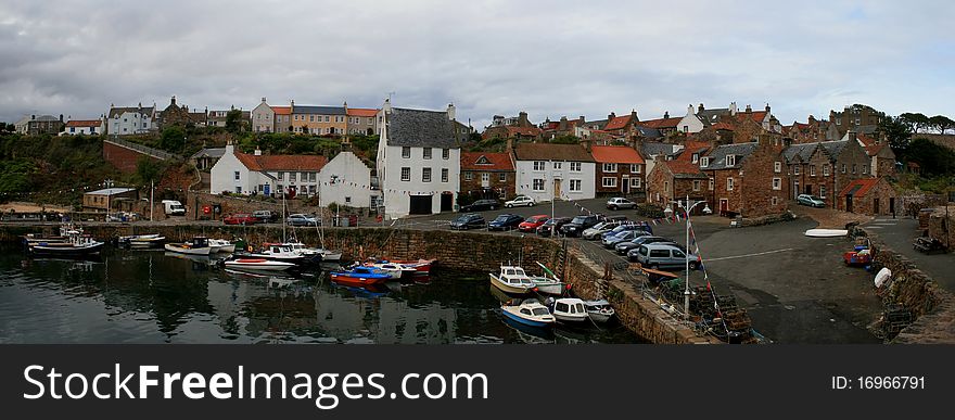 A lovely view of the harbour and fishing boats, with a backdrop of multicoloured houses winding their way up to the top of the hill and into the town centre. A lovely view of the harbour and fishing boats, with a backdrop of multicoloured houses winding their way up to the top of the hill and into the town centre.