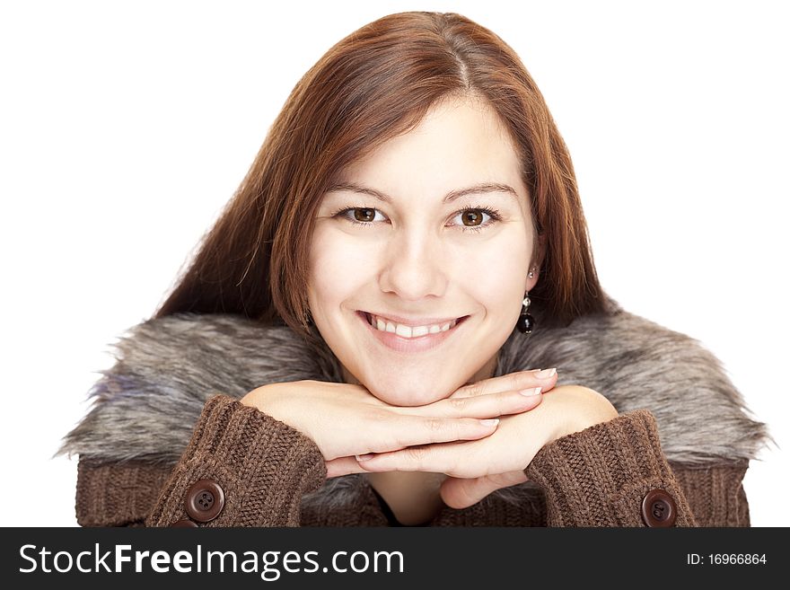 Beautiful young Woman with chin on hands smiling happy into camera. Isolated on white background.